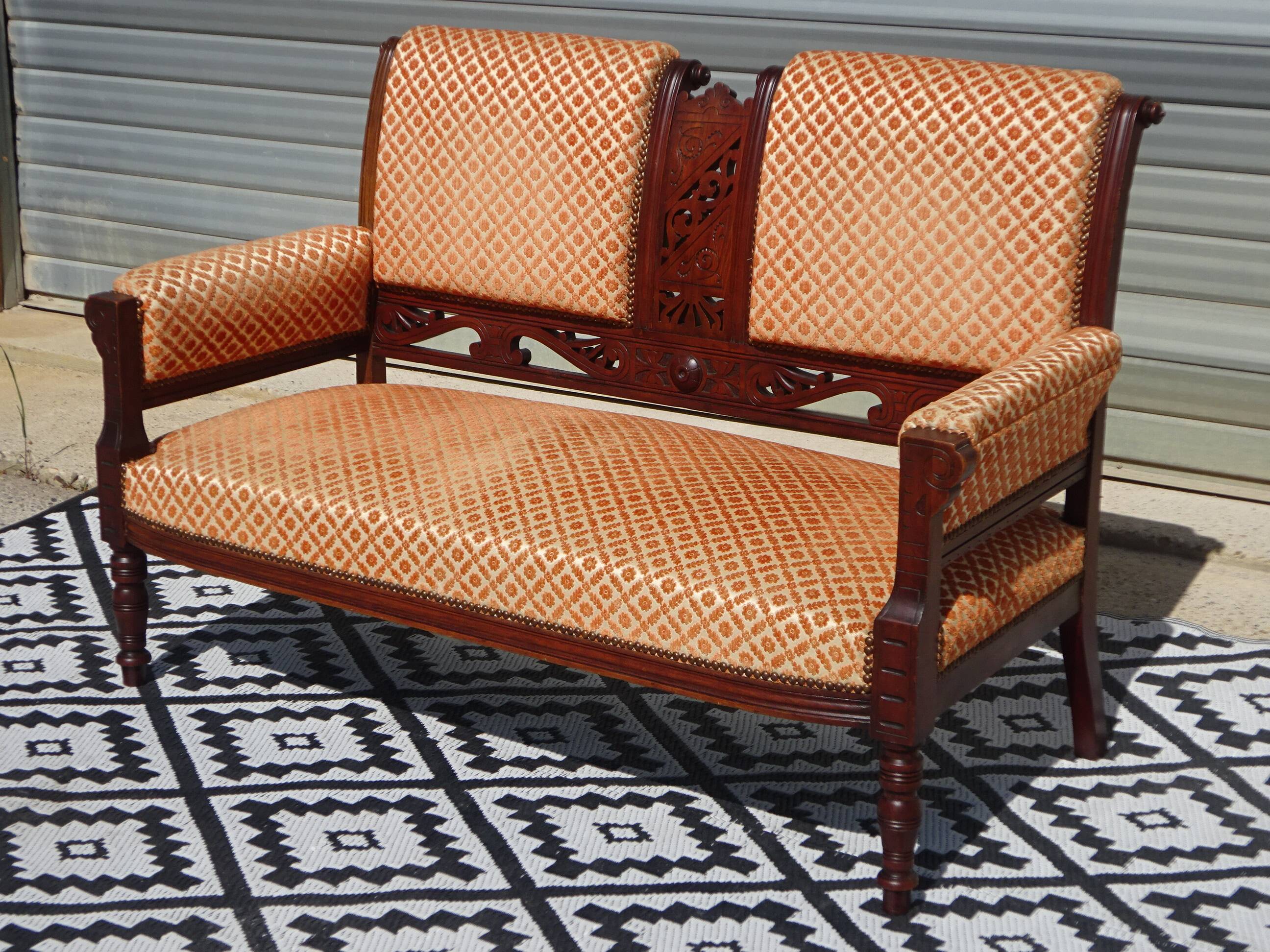 Vintage bench in wood and orange/ivory velvet.