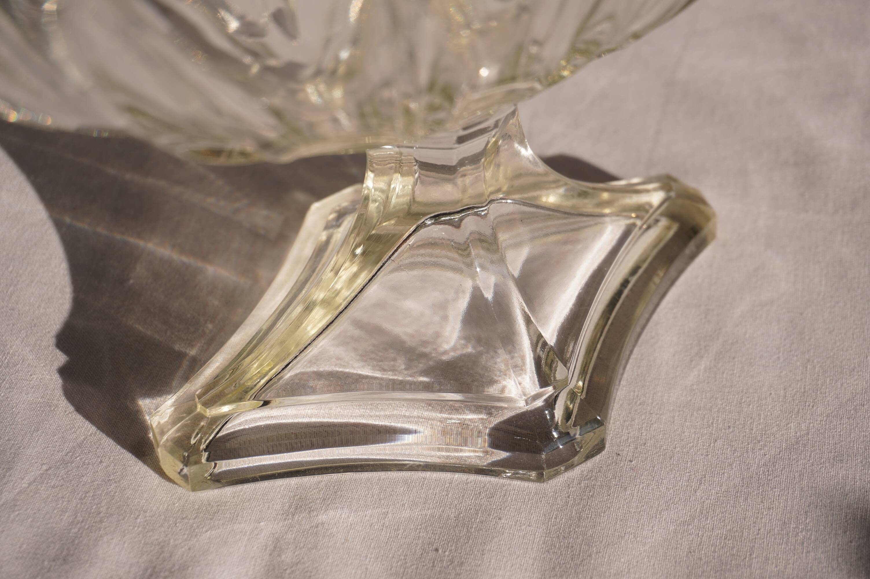 Oval glass fruit bowl on a stand.