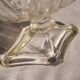 Oval glass fruit bowl on a stand.