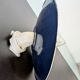 Antique wall light in blue enamel, workshop style.