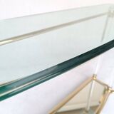 Hollywood Regency console table in lucite, glass and gold metal. 1980s