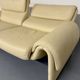 Two-seater designer sofa De Sede DS-2011 in cream leather with adjustable backrest.