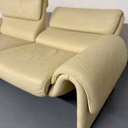 Two-seater designer sofa De Sede DS-2011 in cream leather with adjustable backrest.