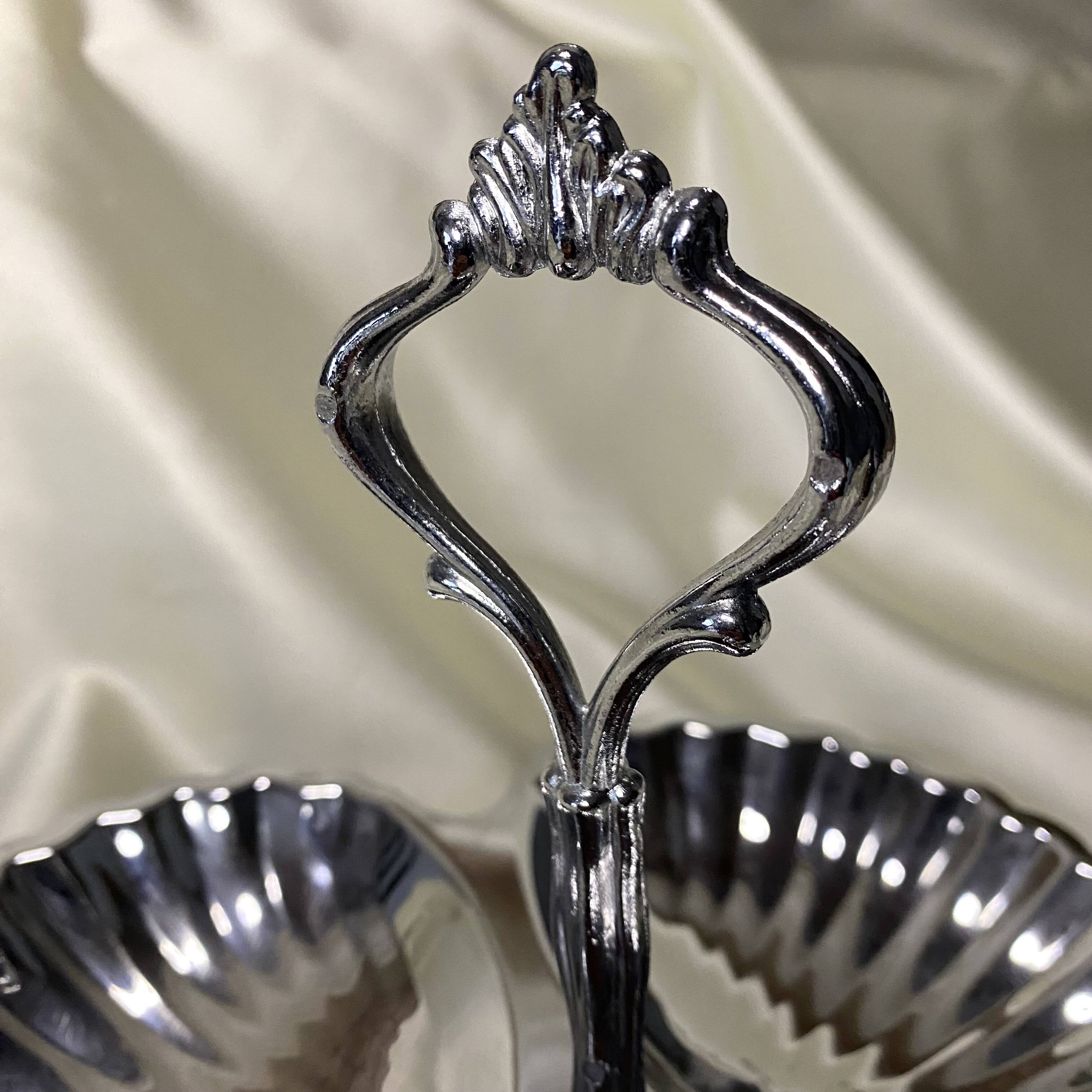 Stainless steel serving platter in the shape of seashells