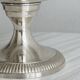 shiny silver metal cup on foot