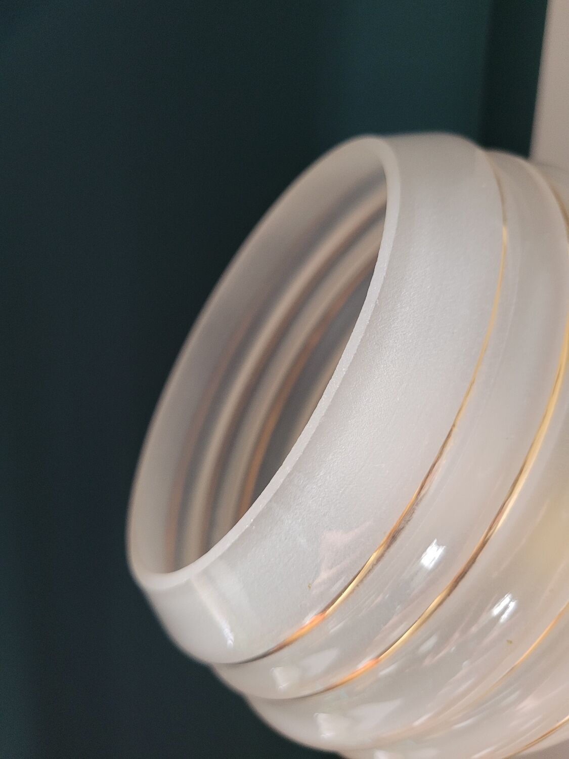 Frosted glass lamp with golden trims