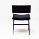 Set of four entirely black Hulmefa dining chairs, Architectural Modernism.