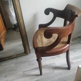 Armchair with canework and bronze detail