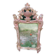 Mirror above a wooden and gilded stucco fireplace in the style of the 18th century.