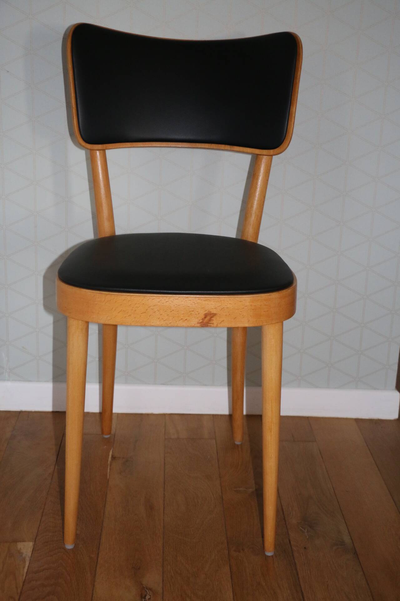 5 baumann chairs with large backs in black faux leather.