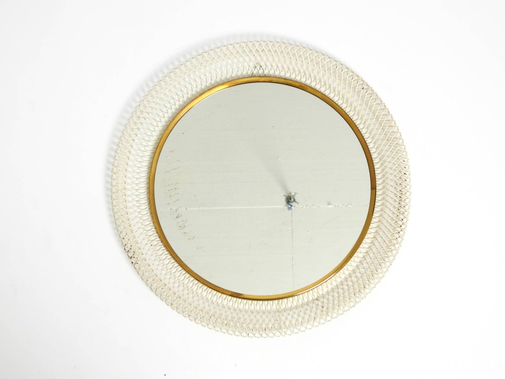 Miroir mural rond de style Mid-Century Modern avec un cadre en métal blanc expansé.