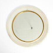 Miroir mural rond de style Mid-Century Modern avec un cadre en métal blanc expansé.