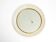 Mid Century Modern round wall mirror with a white expanded metal frame
