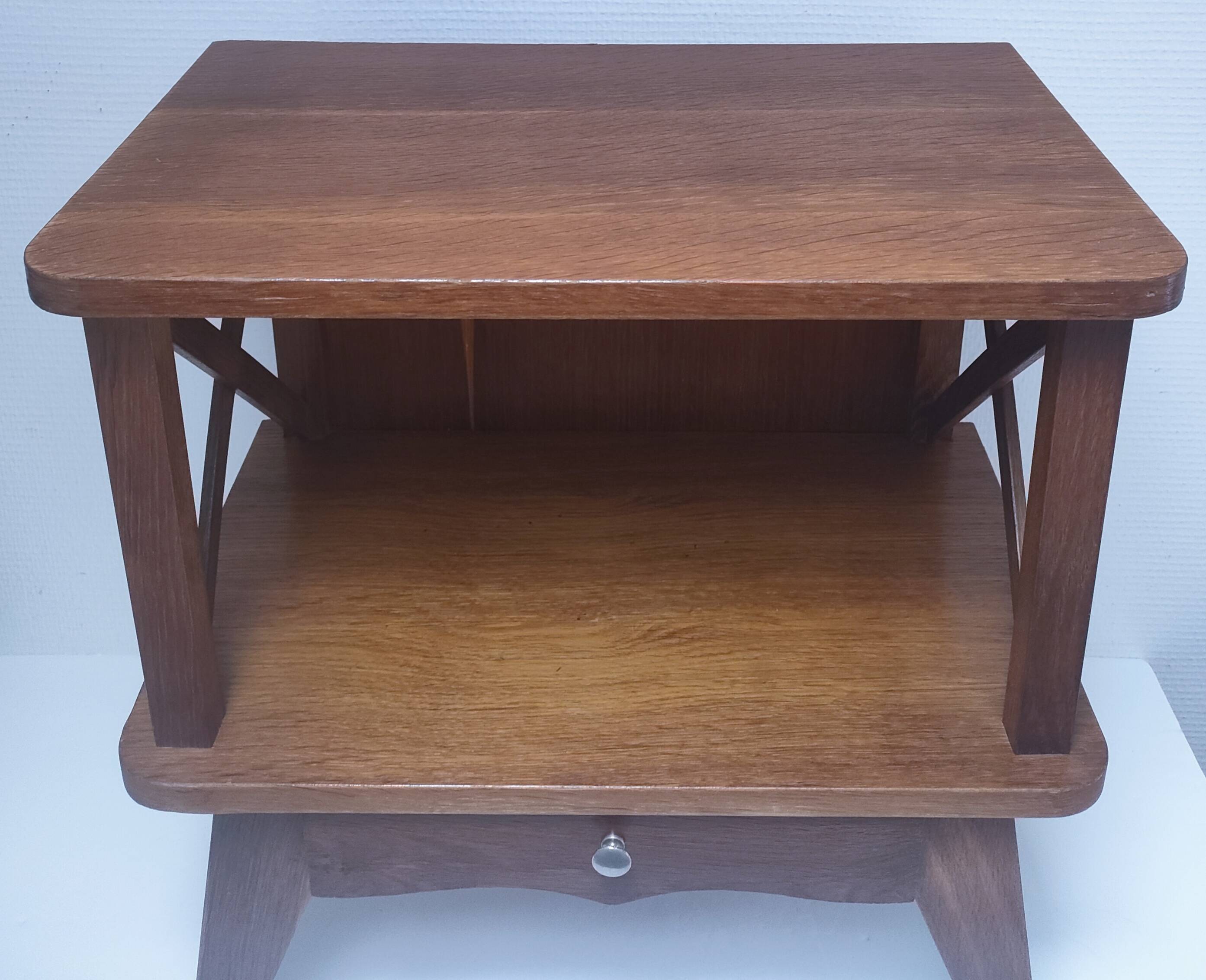 vintage wooden bedside table with crossbars and tapered legs
