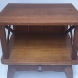 vintage wooden bedside table with crossbars and tapered legs
