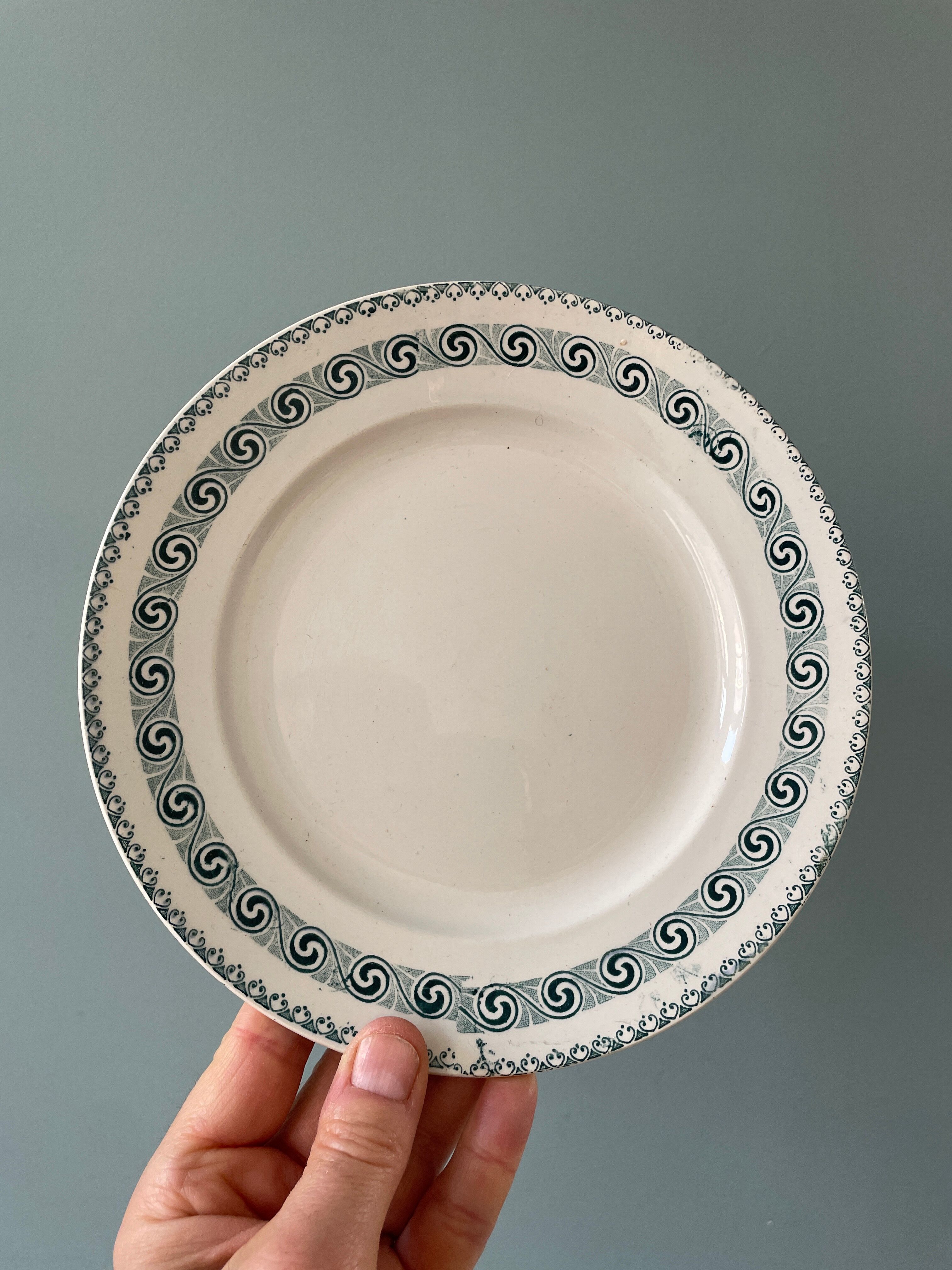 Series of 12 mismatched Terre de Fer dessert plates