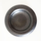 Empty round pocket in black ceramic