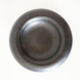 Empty round pocket in black ceramic