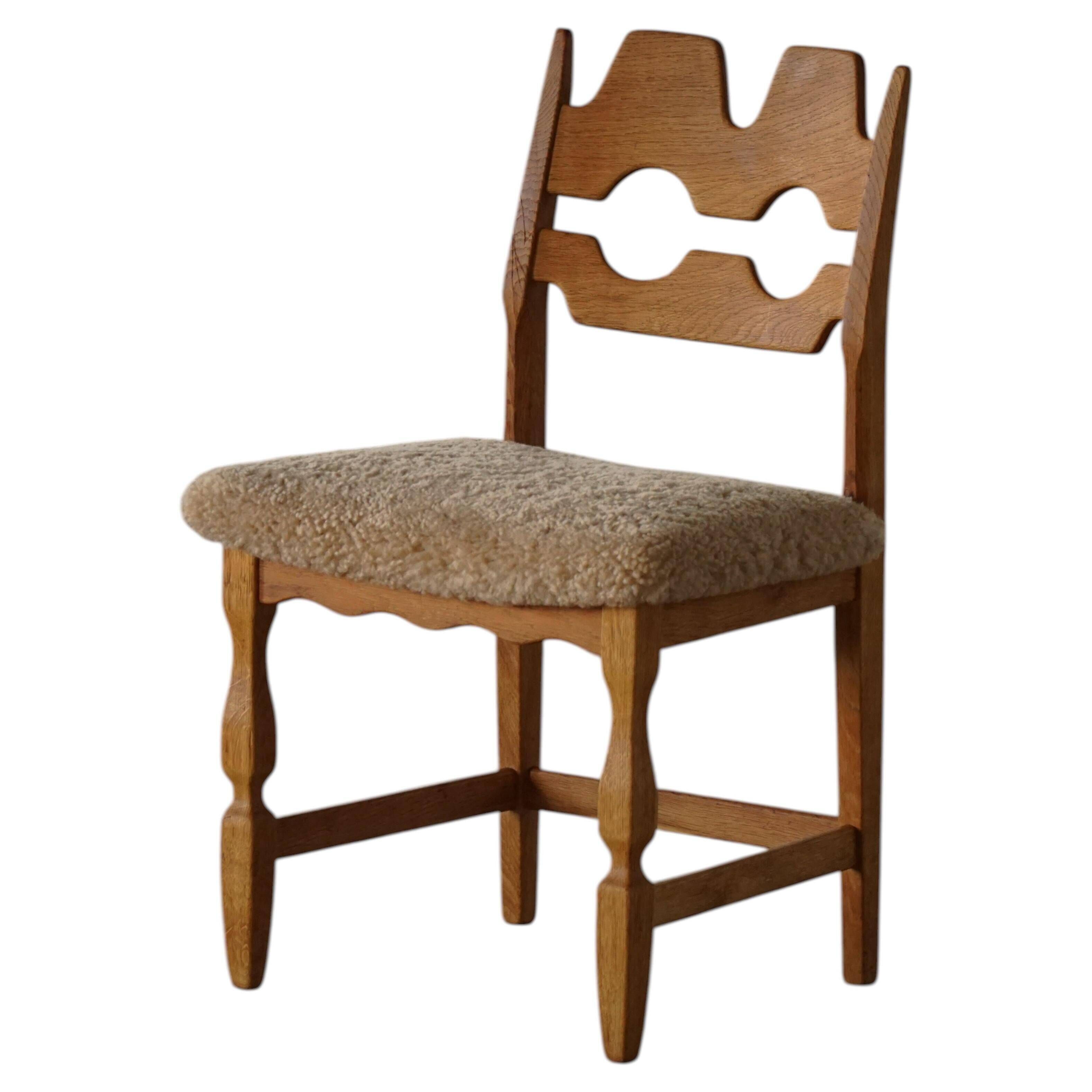 "Razorblade" dining chair by Henning Kjærnulf, in oak and lamb's wool, Denmark, 1960s.