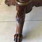 Wooden gueridon with marble, lion paw legs.