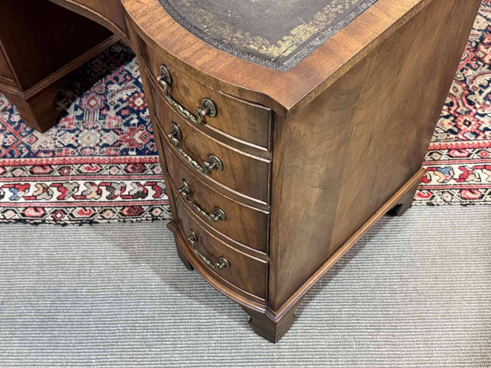 English desk from the 1950s in mahogany with a leather top.