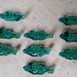 9 knife holders in green earthenware in the shape of a fish