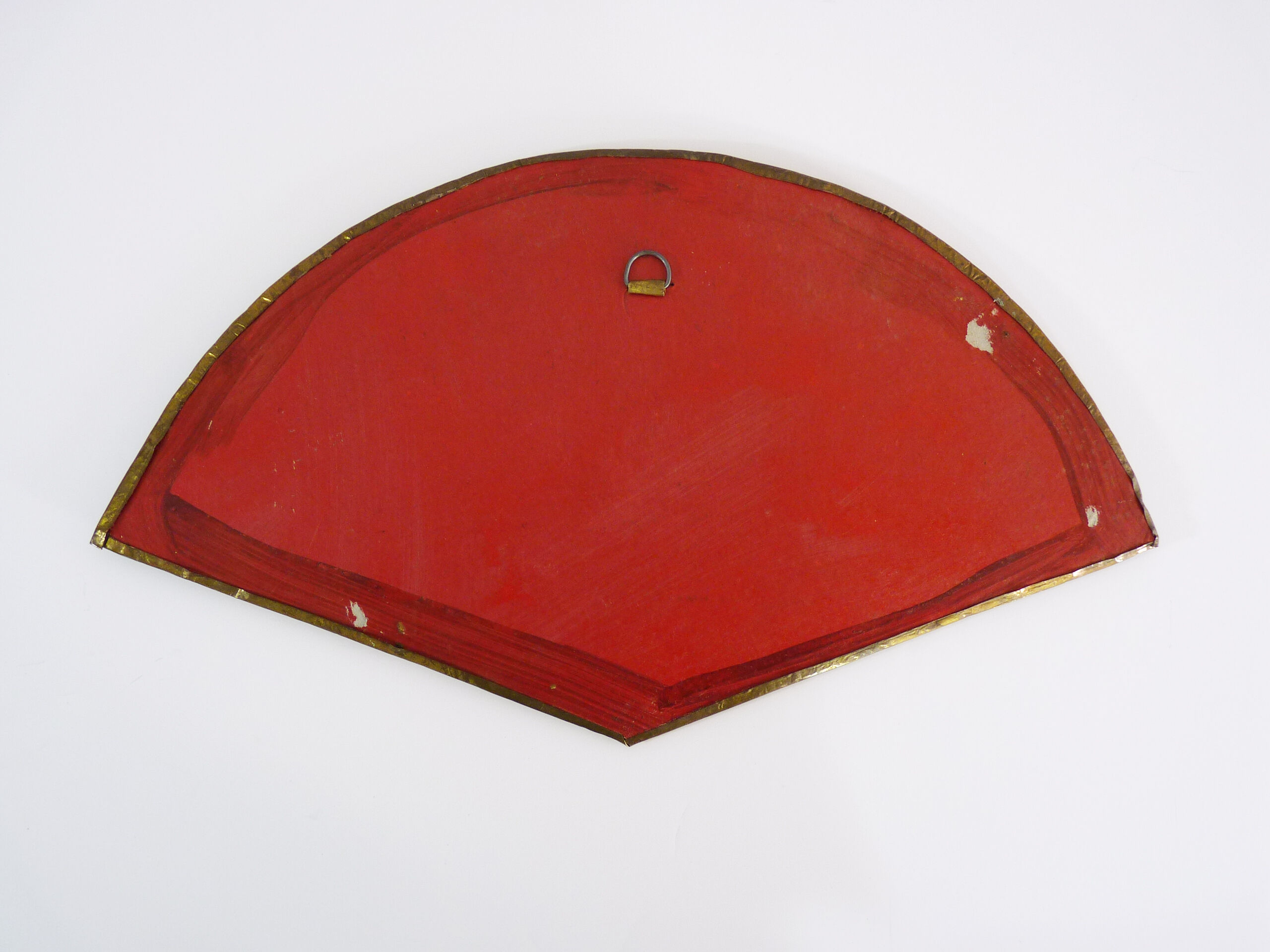 Old wall mirror in the shape of a copper fan pushed back, year 70