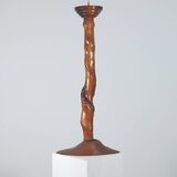 Vintage candle holder in an organic shape with a brass spike and tiered top.