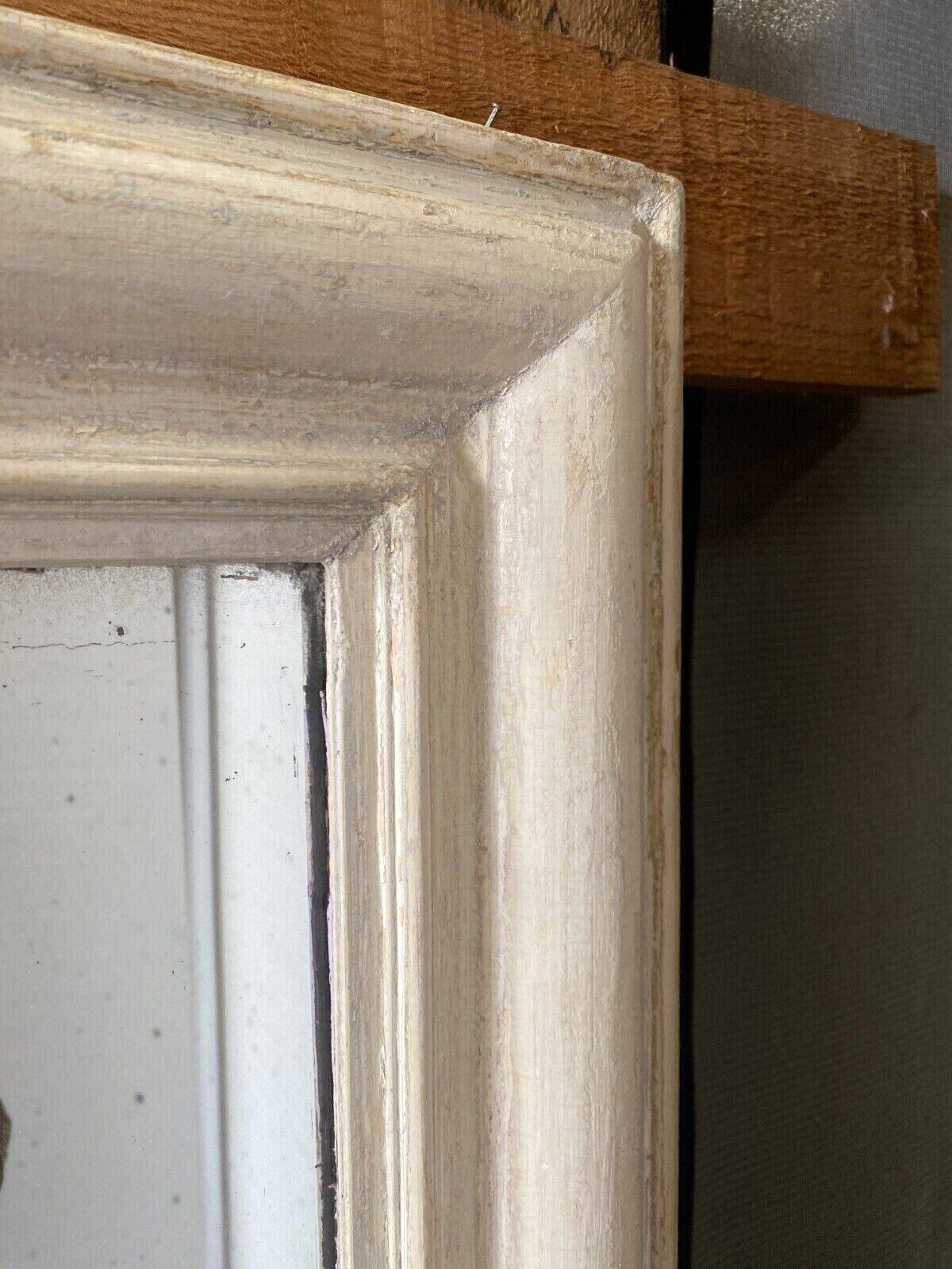 Louis Philippe mirror in wood and patinated stucco 19th century