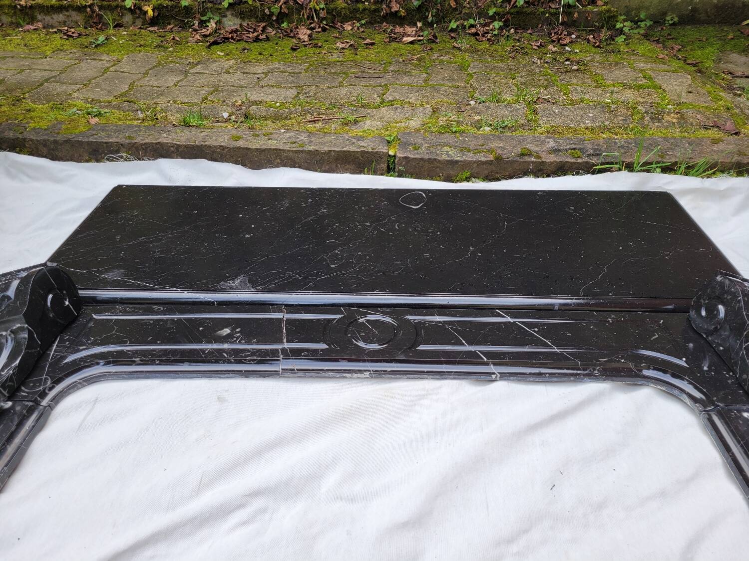 Pompadour fireplace with black marble modillions