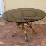 Round table.1970. Rattan and smoked glass. 120cm.