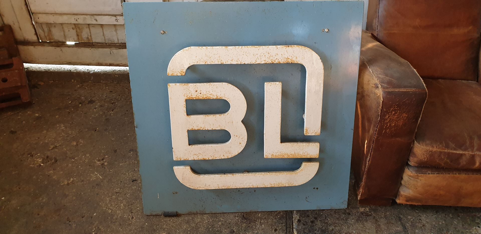 Old metal factory sign