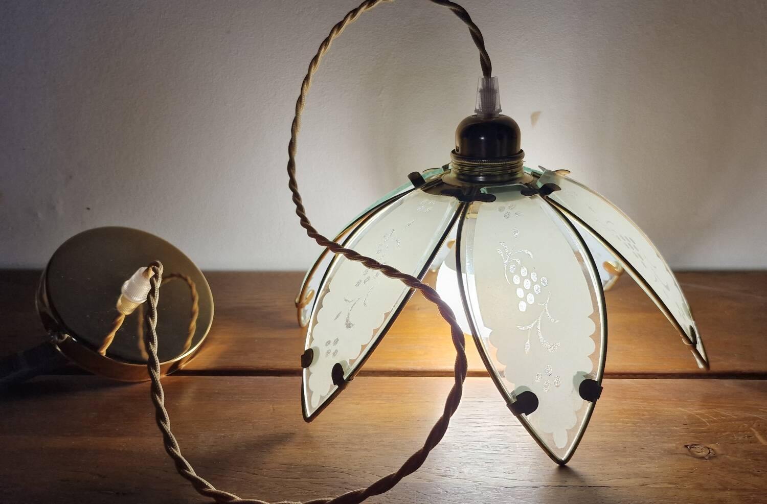 Glass flower rimmed with brass