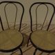 4 Black metal bistro chairs with plastic cane seat