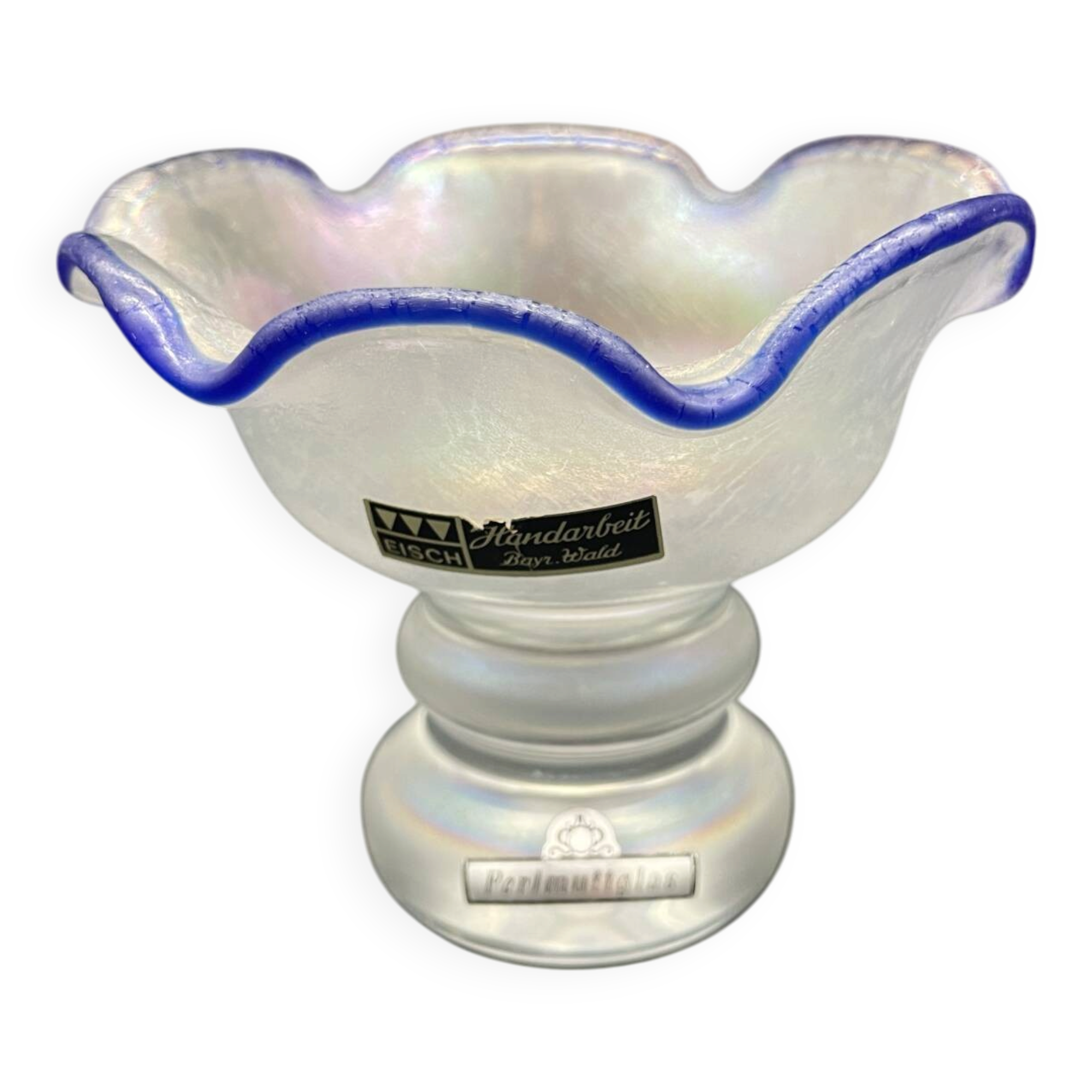 Eisch glass footed cup with pearlescent finish, blue rim.