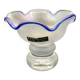 Eisch glass footed cup with pearlescent finish, blue rim.