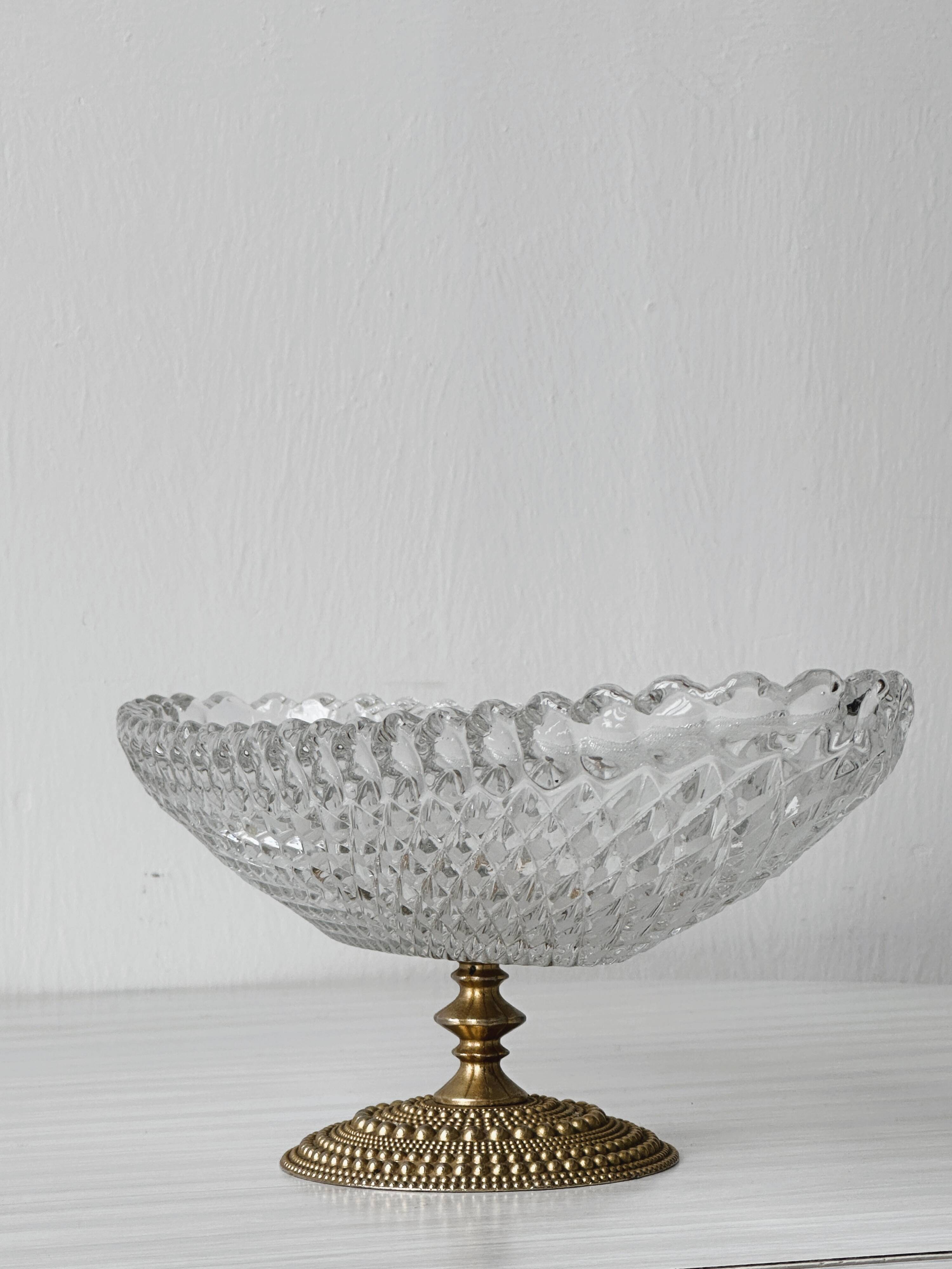 Molded glass bowl with gold metal base