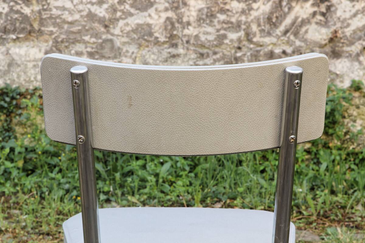 Set of 2 chairs and 1 armchair from the 70s in chrome metal and faux leather.