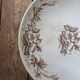 Flat serving compote dish in Terre de Fer HB & Cie with brown floral decoration.