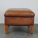 English-style leather ottoman in cognac-colored leather