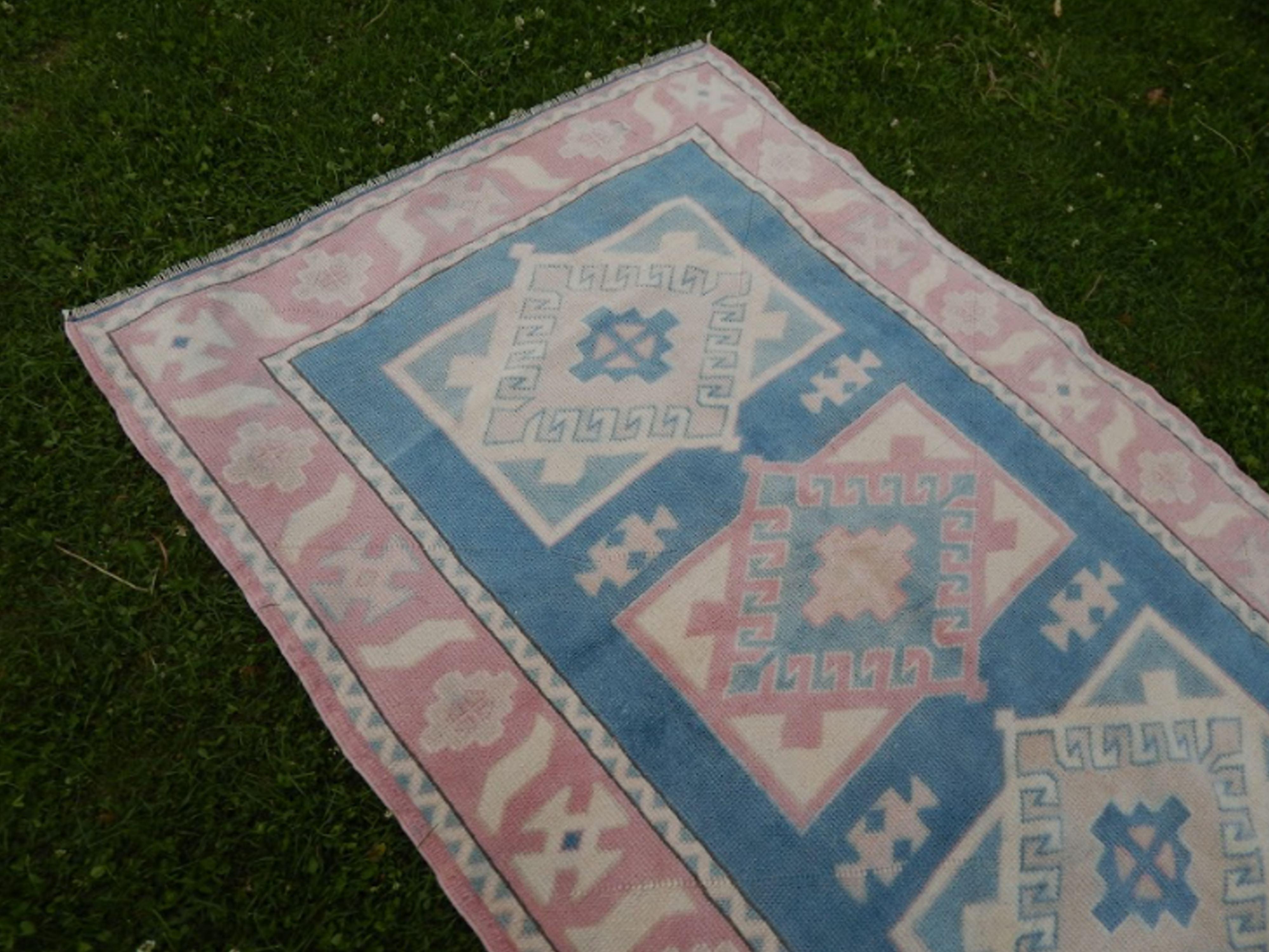Turkish kars rug with rich border - 4′2″ × 6′2″ (128 x 188 cm)