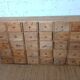 Industrial or apothecary workbench with 30 vintage wooden drawers.