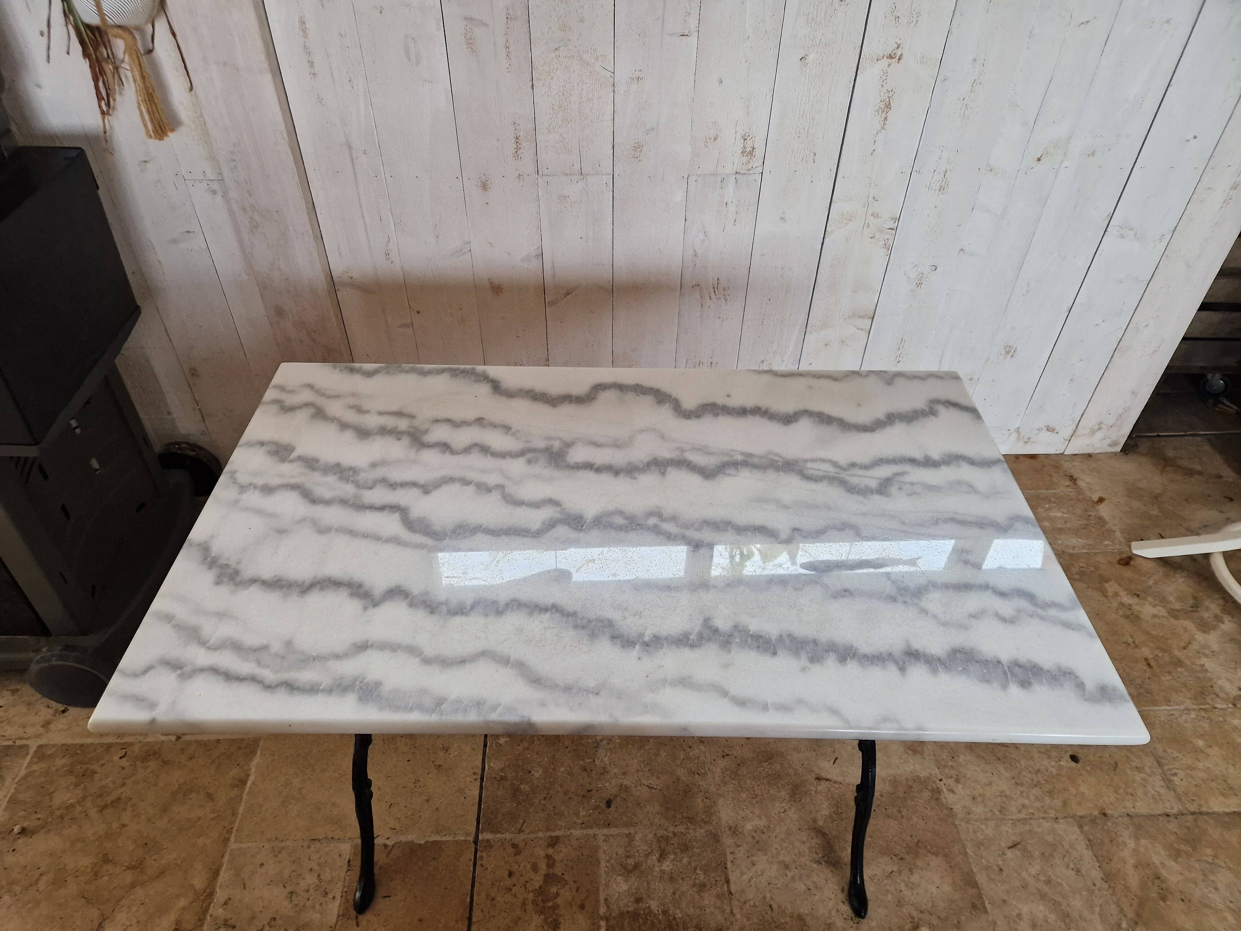 Bistro table with marble top and cast iron legs