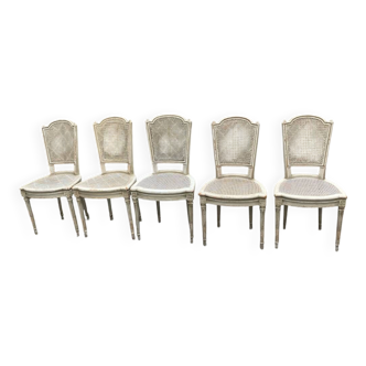 5 white chairs
