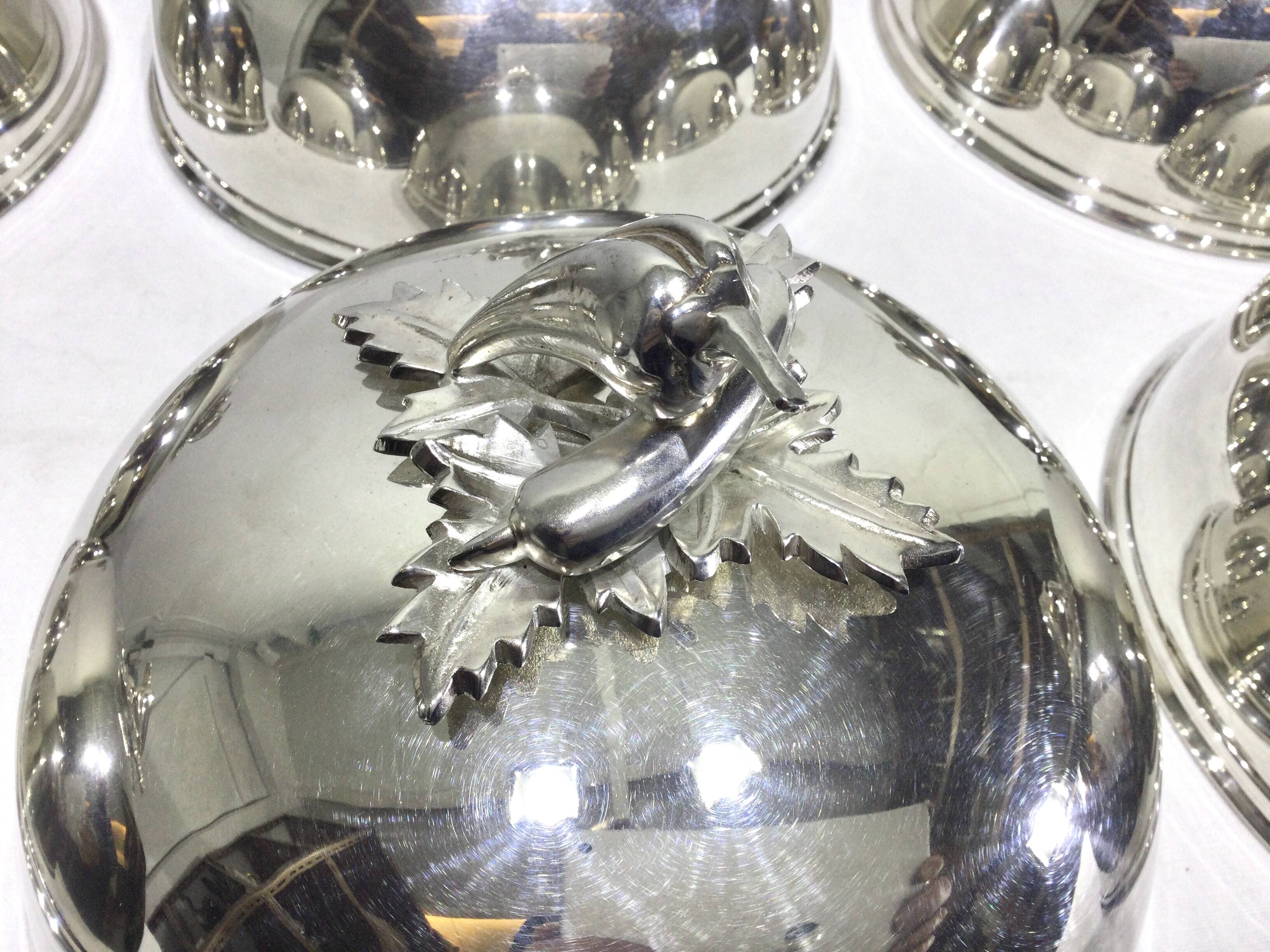 Set of silver-plated serving dishes and bells