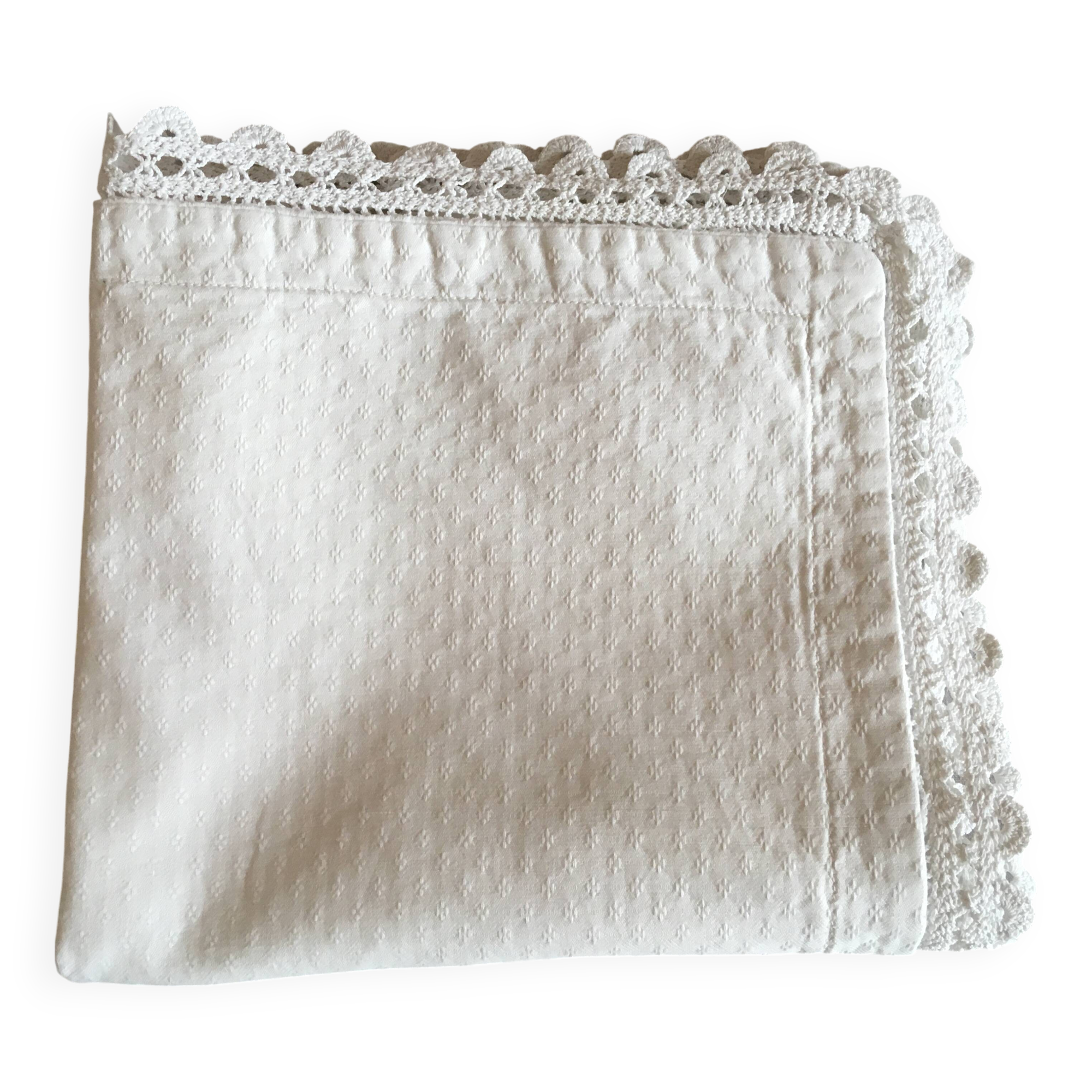 A handmade lace cushion cover