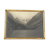 Photo in black and white mountain lake in golden frame