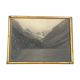 Photo in black and white mountain lake in golden frame