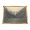 Photo in black and white mountain lake in golden frame