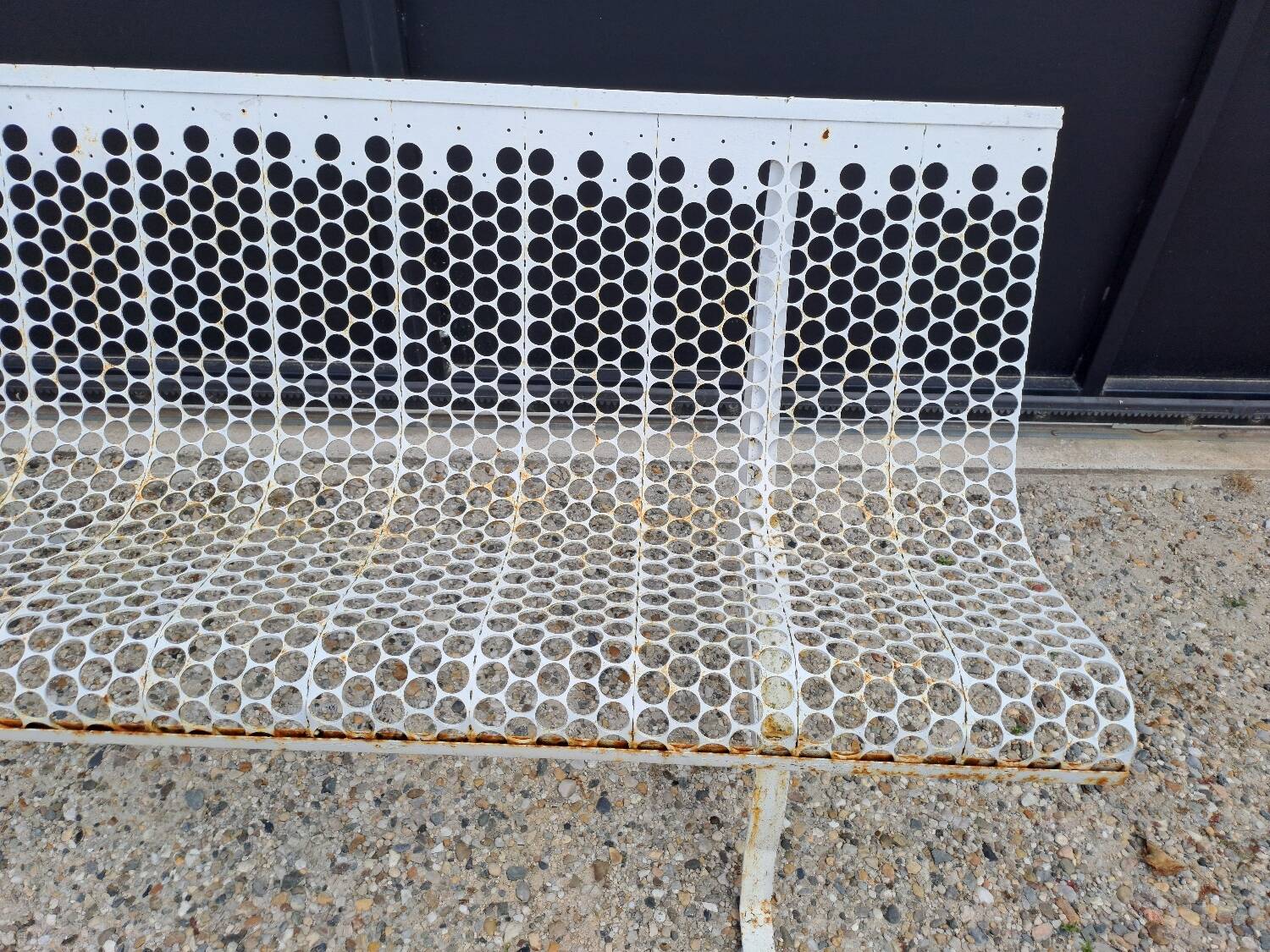 Garden bench in iron and perforated sheet metal